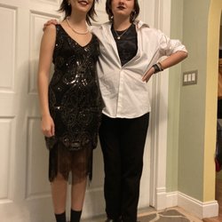 Wearing a flapper dress and hair piece