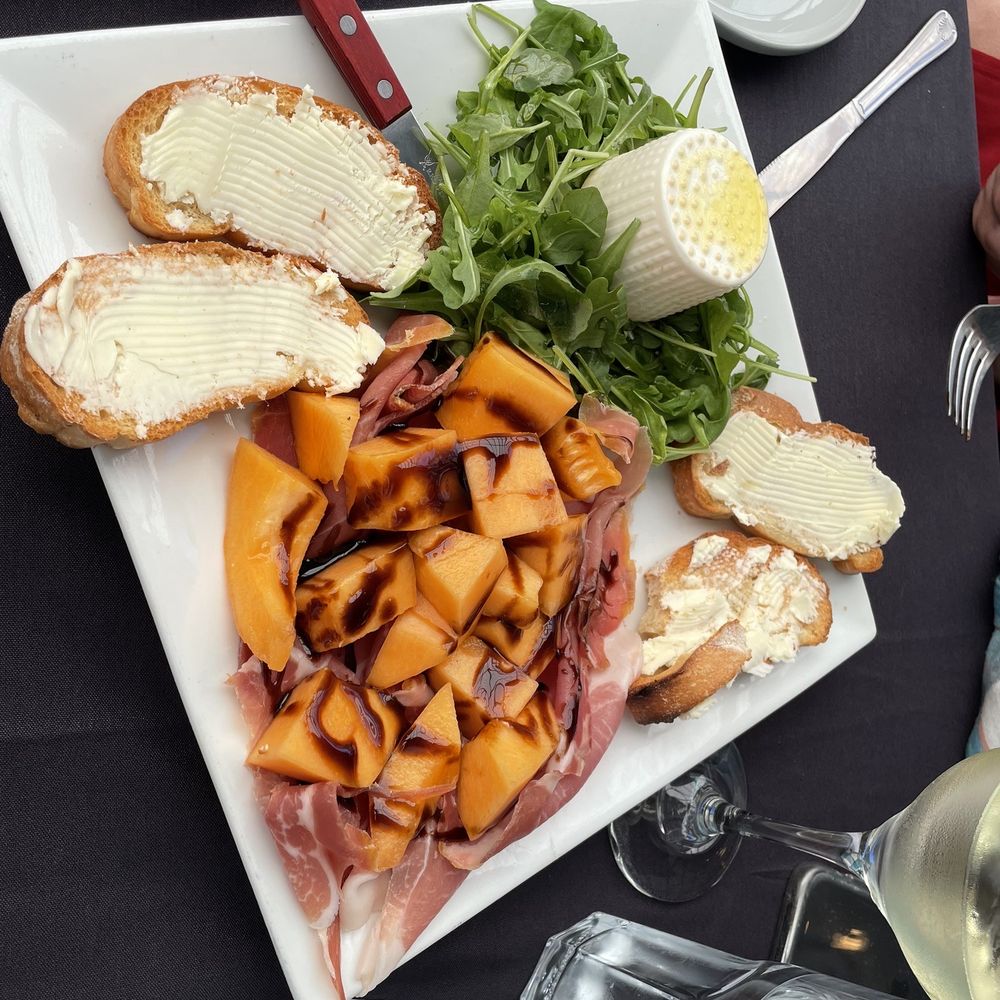 Bedda Mia - Fresh sliced prosciutto, sweet Italian melon, smoked burrata and buttered crostini... what's not to like?! - Italian Near Me - Santa Cruz, California Bedda Mia - Fresh sliced prosciutto, sweet Italian melon, smoked burrata and buttered crostini... what's not to like?! - Italian Near Me - Santa Cruz, California