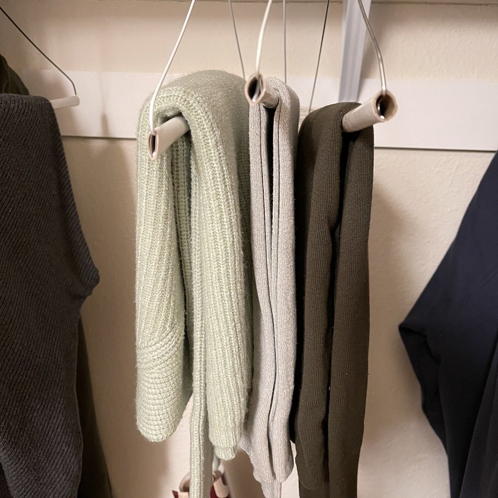 This is how sweaters should hung up on the hangers which this cleaners doesn't seem to understand