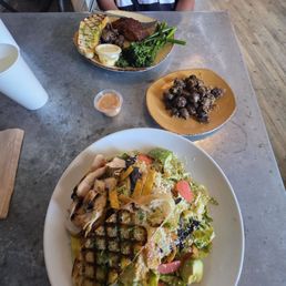 Southwest grilled chicken salad and blackened salmon plate with an extra side of garlic mushrooms.