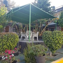 Hotel Avenida - garden with swings far left and merry go round far right