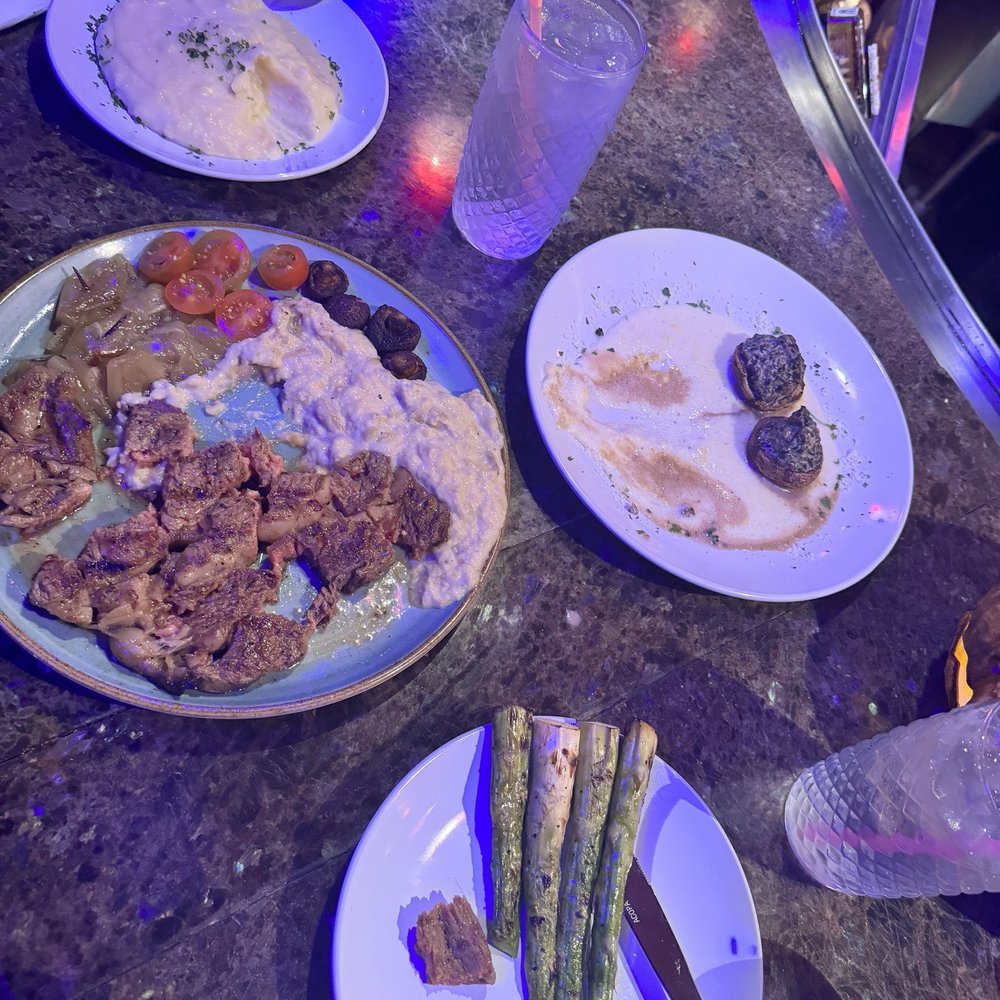 Haunted Castle Cafe - Ribeye w creamy egg plant, asparagus, stuffed mushrooms, mashed potatoes - Seafood Near Me - Plano, Texas