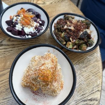 Cask & Larder - Pick 3: (clockwise from upper left.) beet salad, roasted brussels sprouts, & Street corn. - Southern Near Me - Orlando, Florida Cask & Larder - Pick 3: (clockwise from upper left.) beet salad, roasted brussels sprouts, & Street corn. - Southern Near Me - Orlando, Florida