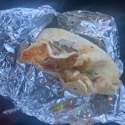 a burrito wrapped in aluminum foil