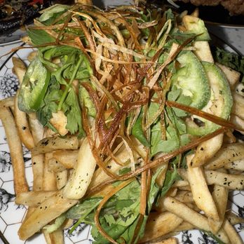 Abang Yoli - "Asian Fries" ($6.99) Hand-cut French fries topped with crispy leeks, cilantro, sliced chili & nori salt. - Korean Near Me - Minnetonka, Minnesota Abang Yoli - "Asian Fries" ($6.99) Hand-cut French fries topped with crispy leeks, cilantro, sliced chili & nori salt. - Korean Near Me - Minnetonka, Minnesota