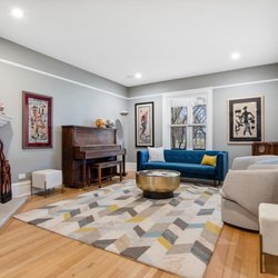 Aaron Walsh -  Real Estate Agent w/ @properties - Stylish living room with gas fireplace and view of Fort Sheridan parade grounds.