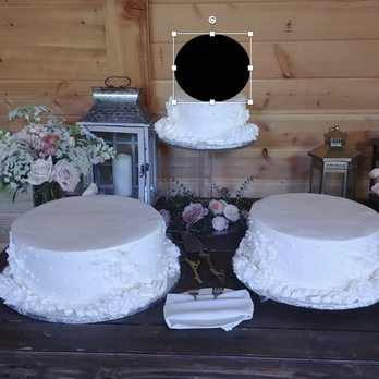 Flowers By Mae Mae - $45 for a "big cascade" of flowers. Why don't I see a single flower on the cake? - Florists Near Me