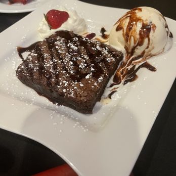 Monroe’s Restaurant - Warm Brownie with vanilla ice cream and chocolate sauce - American Near Me - Westbury, New York Monroe’s Restaurant - Warm Brownie with vanilla ice cream and chocolate sauce - American Near Me - Westbury, New York