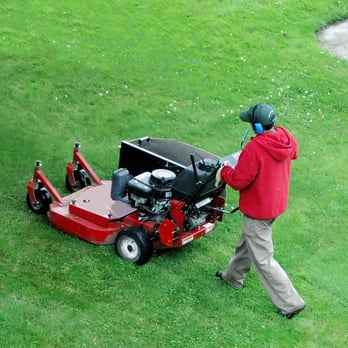 Total Turf Lawn Care - a man mowing the grass - Lawn Services Near Me - Erie, Colorado Total Turf Lawn Care - a man mowing the grass - Lawn Services Near Me - Erie, Colorado