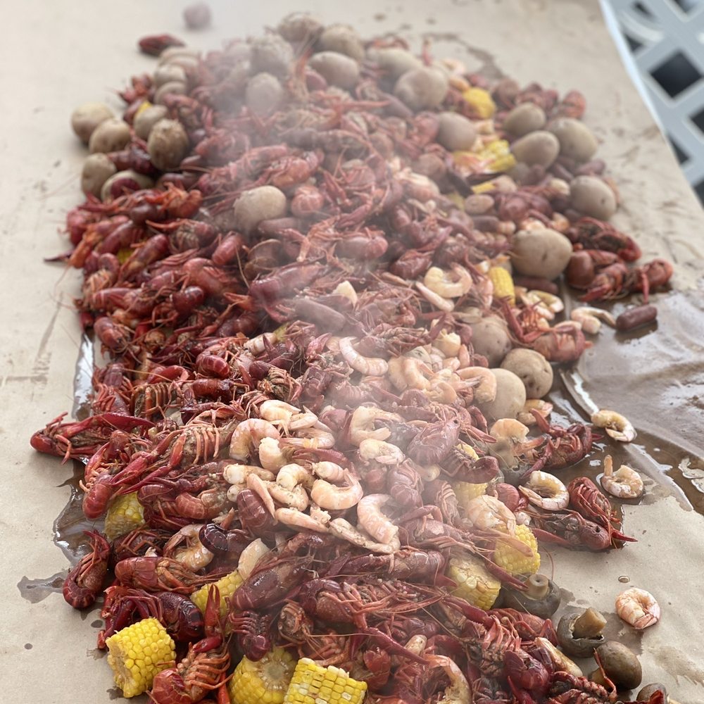 Cosmic Bottles - A delicious crawfish fish boil, almost ready for guest to eat. - Beer Bar Near Me - Covington, Washington