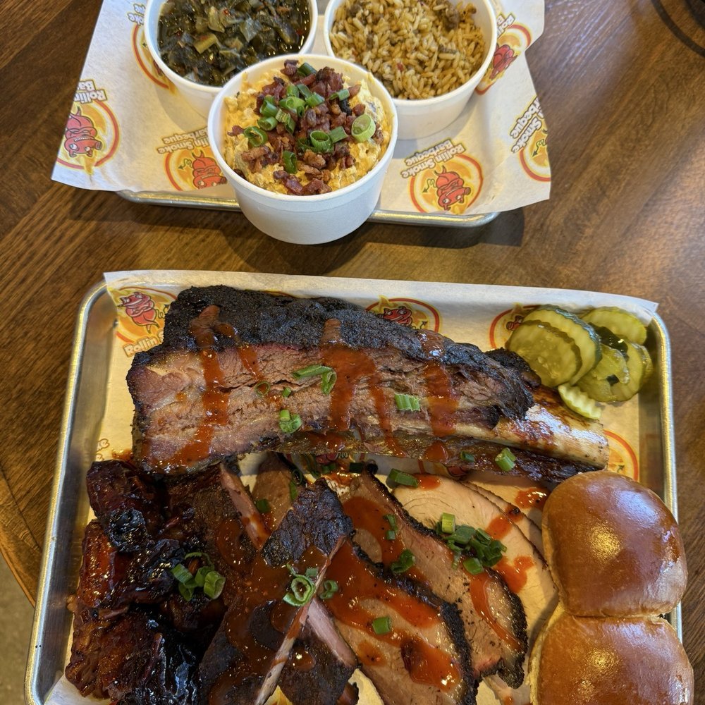 Turkey, Brisket, Beef Rib, Burnt Ends, Ribs, Collard Greens, Dirty Rice, Potato Salad, Rolls, and Pickles Turkey, Brisket, Beef Rib, Burnt Ends, Ribs, Collard Greens, Dirty Rice, Potato Salad, Rolls, and Pickles