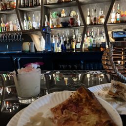Pizza from the back with a drink called: HUMUHUMUNUKUNUKUAPUA'A both delicious