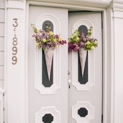 Garden Party Floral - Historic Saint Paul's church in Port Gamble, Washington decorated for a spring wedding.  Photo by Tracey Salazar Photography