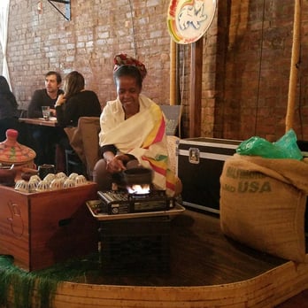 Bunna Cafe - The Bunna coffee being made on the spot by this beautiful Ethiopian woman! - Ethiopian Near Me - Brooklyn, New York Bunna Cafe - The Bunna coffee being made on the spot by this beautiful Ethiopian woman! - Ethiopian Near Me - Brooklyn, New York
