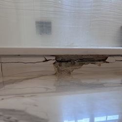 Grout Worx - We started with a crack...Chris started to remove the tile and never completed the job.