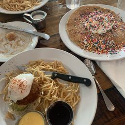 Cinnamon roll(already devoured) crab cake Benedict and a surprise birthday pancake! Delicious coffee.