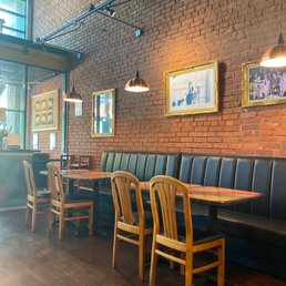a restaurant with a brick wall a restaurant with a brick wall