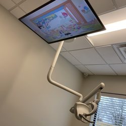 Crabtree Pediatric Dentistry - TV with Bluey on above the dentist chairs