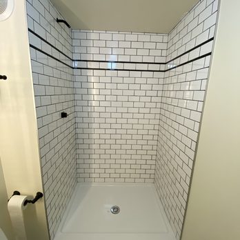 Elite Build Construction - a bathroom with a toilet and shower - General Contractors Near Me - Los Angeles, California Elite Build Construction - a bathroom with a toilet and shower - General Contractors Near Me - Los Angeles, California