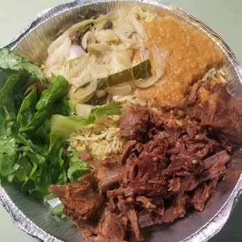Hoyo's Kitchen - Goat, lentils, cabbage, and salad on rice. Lunch doesn't get any better than this. - African Near Me - Columbus, Ohio Hoyo's Kitchen - Goat, lentils, cabbage, and salad on rice. Lunch doesn't get any better than this. - African Near Me - Columbus, Ohio