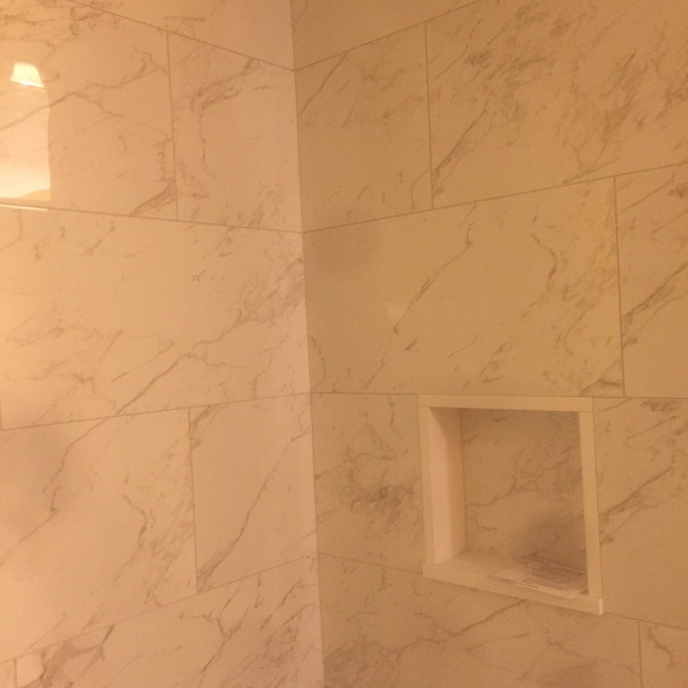 Tile Source - a bathroom with a toilet and shower - Flooring Near Me - Framingham, Massachusetts Tile Source - a bathroom with a toilet and shower - Flooring Near Me - Framingham, Massachusetts