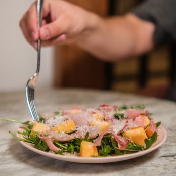 Moontower Social Club - a person eating a salad - Bars Near Me - Phoenix, Arizona Moontower Social Club - a person eating a salad - Bars Near Me - Phoenix, Arizona