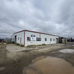 Exterior of hangar with porta potty