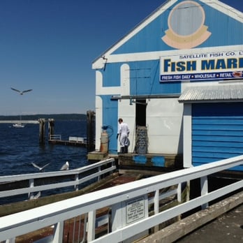 Satellite Fish Company - a man walking on a pier - Seafood Markets Near Me - Sidney, British Columbia Satellite Fish Company - a man walking on a pier - Seafood Markets Near Me - Sidney, British Columbia