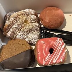 Clockwise from top left: tabernacle croissant, strawberry donut, mixed berry cronut, s'mores cookie)