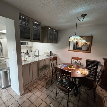 The Cabinet Firm - a kitchen and dining room - Cabinetry Near Me