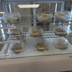 Buenos Dias Coffee - Pastry Cabinet, today stocked with marzipan cheesecake, flan, and bread pudding.
