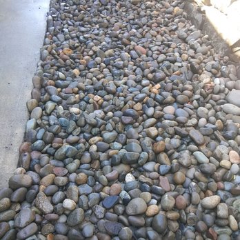 Sanchez Landscaping - a gravel path lined with rocks - Tree Services Near Me Sanchez Landscaping - a gravel path lined with rocks - Tree Services Near Me