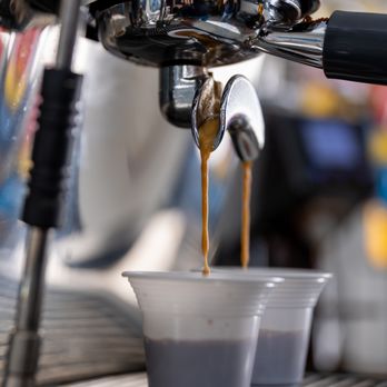 Enticing Coffee - double espresso pour closeup for coladas and iced and hot espressos - Coffee & Tea Near Me - Davie, Florida