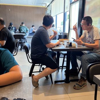Princess Dumpling - Manager in Nike outfit and shorts. Associate who just sat down and got food right away and eating while we waited an hour for food. - Dim Sum Near Me - Rowland Heights, California