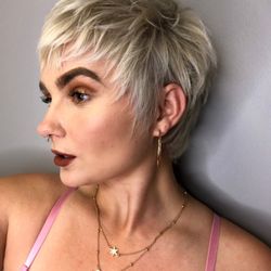 Full bleach and tone with a short textured pixie.