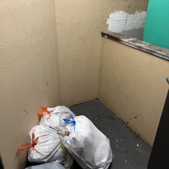 Wildflower - Garbage overflow. Remember paying that $35/mo for trash pick up? This is where it goes. - Apartments Near Me - Gainesville, Florida