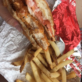 Wendy's - a hand holding a sandwich and french fries - Burgers Near Me - Pittsburgh, Pennsylvania Wendy's - a hand holding a sandwich and french fries - Burgers Near Me - Pittsburgh, Pennsylvania