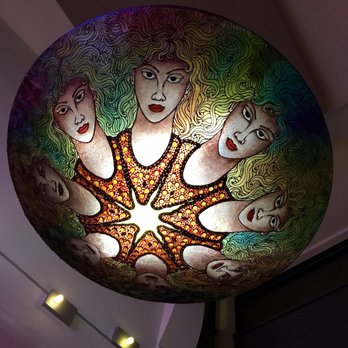 Pizzedelic - a colorful ceiling light with faces on it - Salad Near Me - Quebec City, Quebec