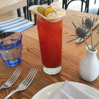 Porto - House Bloody Mary with oyster shell with olive and fresh shaved horseradish garnish! - Seafood Near Me - Boston, Massachusetts