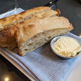 Current Fish & Oyster - Sourdough foccacia bread. His and hers favorite combined - Seafood Near Me - Salt Lake City, Utah Current Fish & Oyster - Sourdough foccacia bread. His and hers favorite combined - Seafood Near Me - Salt Lake City, Utah