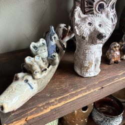 The Lucky Dumpster - A spirit boat and a wolf sculpture
