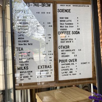Paper Plane Coffee - Menu on the window. During COVID, they have a tent outside the store - Coffee Roasteries Near Me - Montclair, New Jersey Paper Plane Coffee - Menu on the window. During COVID, they have a tent outside the store - Coffee Roasteries Near Me - Montclair, New Jersey