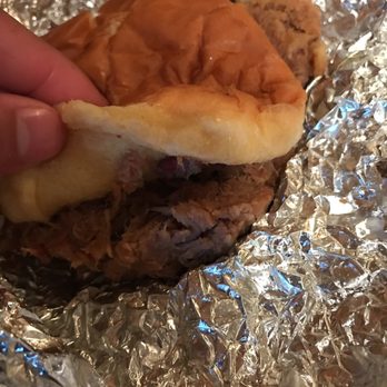 Cook Out - a hand holding a half eaten sandwich - Desserts Near Me - Fort Oglethorpe, Georgia Cook Out - a hand holding a half eaten sandwich - Desserts Near Me - Fort Oglethorpe, Georgia