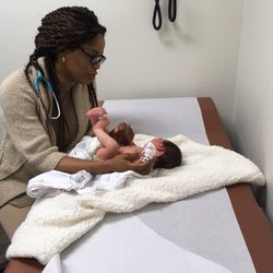 Onyinye Okezie, MD - Okezie Pediatrics - Dr. Okezie talking to our princess during her checkup