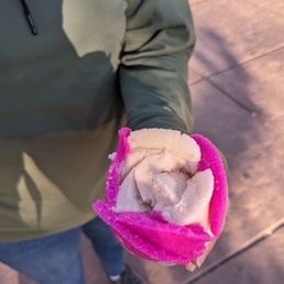 a person holding a desert icecream