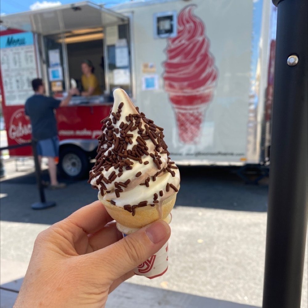 Gibson’s Soft Serve - a hand holding an ice cream cone - Food Trucks Near Me - Bowling Green, Virginia Gibson’s Soft Serve - a hand holding an ice cream cone - Food Trucks Near Me - Bowling Green, Virginia