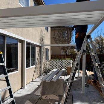 Made by Andrew - White gazebo with drop-down screens installation in progress - Furniture Assembly Near Me