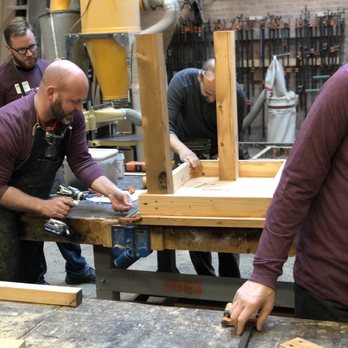 Rebuilding Exchange - Installing the legs on the conference table - Building Supplies Near Me - Chicago, Illinois