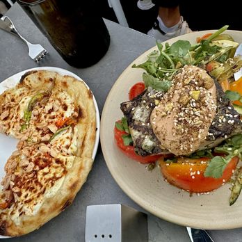 The Wine Bar - Zucchini Blossom and Ricotta Flatbread on left, Striped Bass on the right. - Wine Bars Near Me - Hollywood, California