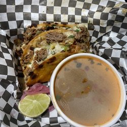 Dripped Birria - QuesaBirra Tacos not a $12 plate. Definitely caught a contact buzz in that check out line.